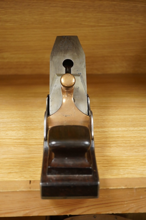 A Spiers dovetailed 14 1/2” panel plane, stamped with Spiers, Ayr to the brass lever cap and fitted with a Sorby iron, with rosewood infill